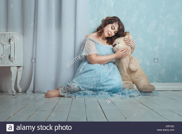 plump woman pics photo room woman plump floor stock bear sitting hugging comp gently tgd