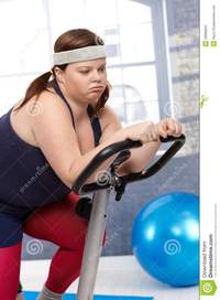 free fat woman pics exhausted fat woman exercise bike royalty free stock photography