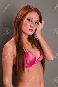 hot red head pics disorderly beautiful young redhead hot pink lingerie stock photo