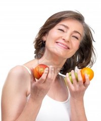 naked mature females logos mature woman holding fruit against white background photo