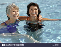 photo of mature women comp awrw mature women swimming pool smiling stock photo