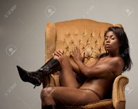 pic of black naked women mocker portrait young topless naked voluptuous sensual hispanic woman brown panties black leather stock photo