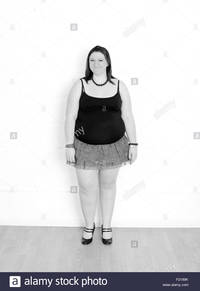 plump woman pics comp plump young woman skirt stock photo