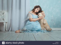 plump woman pics comp tgd plump woman sitting floor room gently hugging bear stock photo