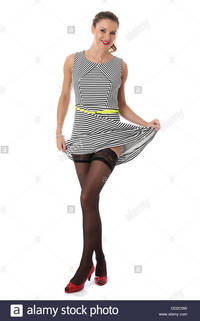 stocking sexy picture comp model released sexy young woman raising skirt showing stocking tops stock photo